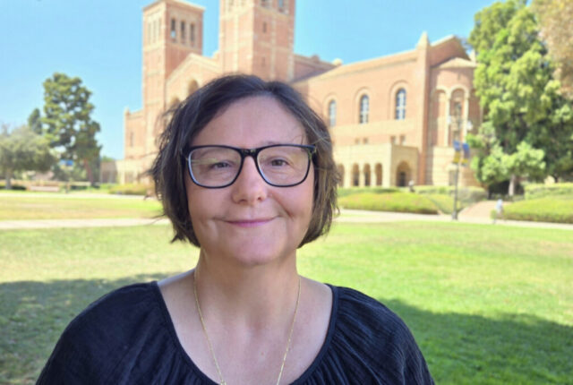 Tanya Ivanova-Sullivan stands in front of UCLA Royce Hall.